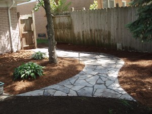 The final flagstone walkway with new double shredded hardwood mulch view 1 Troy, MI